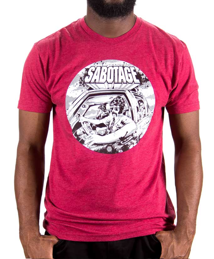 Skinnybuddha Sabotage graphic T-shirt in maroon, worn by a model with the crew neck and white circular artwork visible