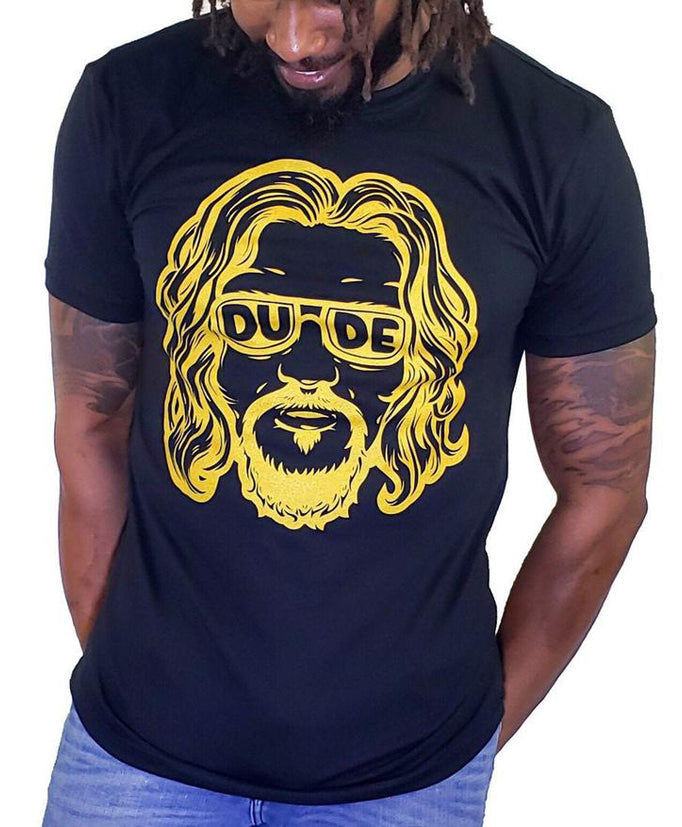 Skinnybuddha The Dude black graphic T-shirt with gold portrait artwork, shown on a model